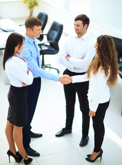 Wall Mural - businessman shaking hands to seal a deal with his partner