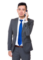 Wall Mural - Young Businessman talk to mobile phone