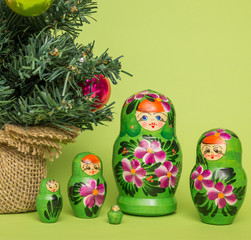 Wall Mural - Russian wooden dolls around a Christmas tree