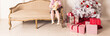 © satura_ - baby  near a Christmas tree with gifts