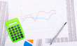 © aperturesound - Calculator and pen on financial report
