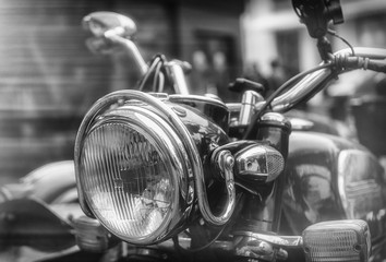 Close up of a headlight of a classic motorcycle