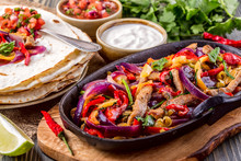 Pork Fajitas With Onions And Colored Pepper, Served With Tortillas.