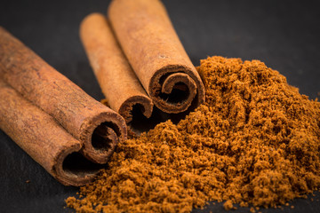 Wall Mural - Cinnamon sticks with powder