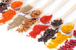collection of spices on spoons, isolated background