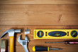 Closeup of assorted work tools on wood