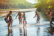 © jackfrog - Young people having fun at the beach during a summer day.