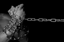 Man's Hands In Chains