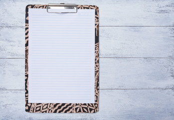 Wall Mural - Blank note pad on colorful paper clipboard with space on wood floor