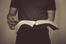Vintage Tone Of Man Reading The Holy Bible.