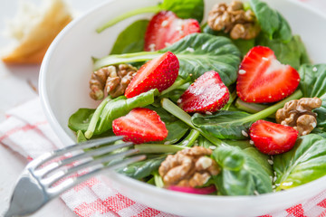 Wall Mural - Strawberry salad in white bowl