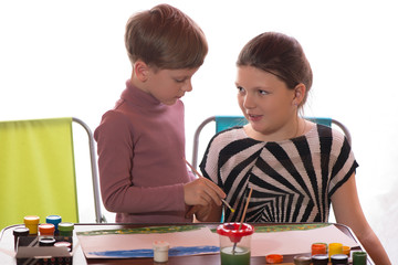 Boy and girl paint