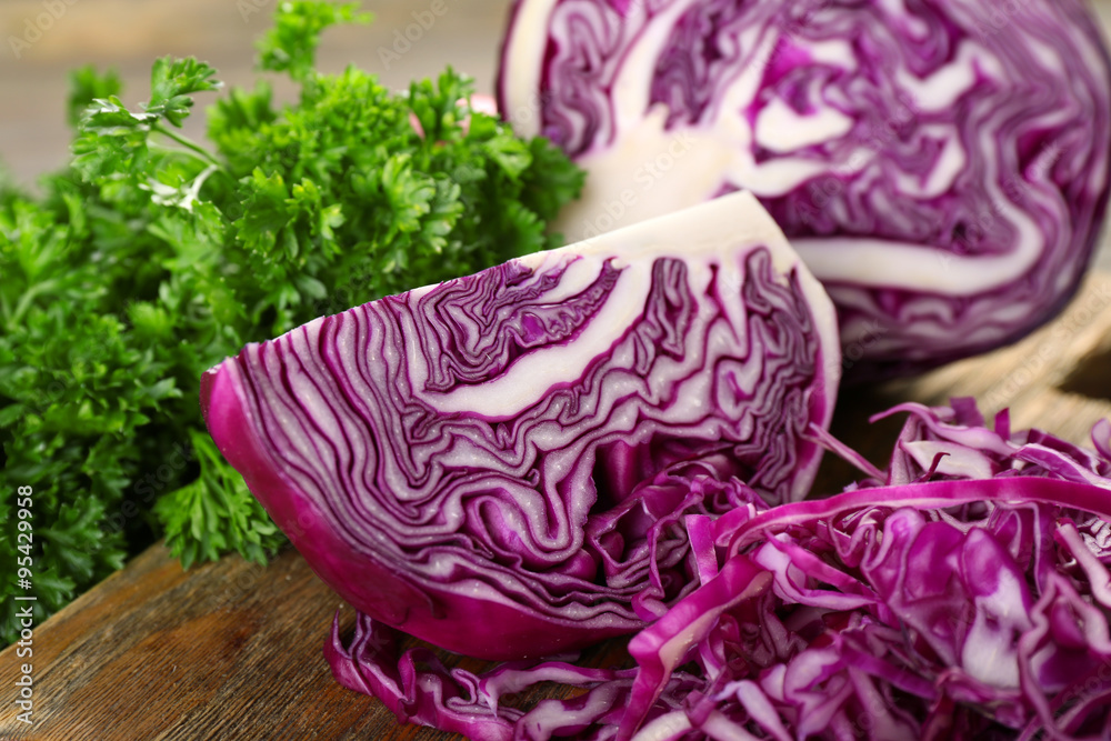 Red cabbage and parsley on wooden table