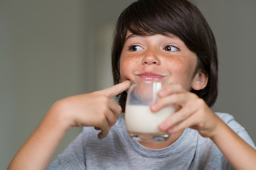 Young boy drinking milk