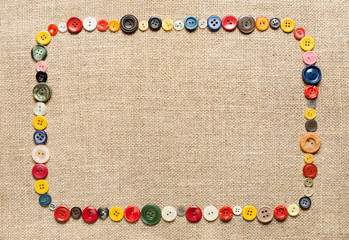 Buttons frame on fabric texture background