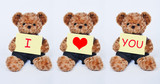 Fototapeta Zwierzęta - Teddy bear holding a  yellow sign saying I love you isolated on white background