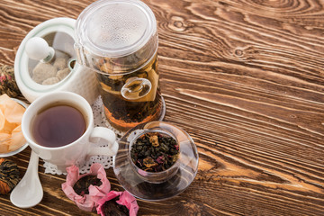  Tea cups with teapot on old wooden table