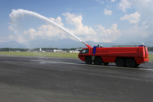 Big Red Airport Firetruck Using A Water Cannon On The Runway