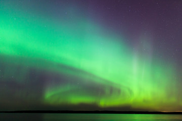 Wall Mural - northern lights over lake in finland