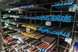 A series of different sizes steel pipes on shelf