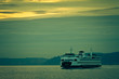Crossing the Sound / A ferry crosses the Puget Sound near Seattle as the sun sets.