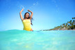 © Gerisima - Happy woman playing with water on exotic beach
