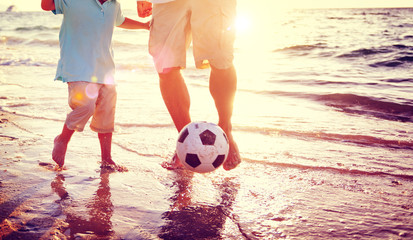 Canvas Print - Father Son Playing Soccer Beach Summer Concept