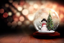 Christmas Tree And Snowman In Snow Globe
