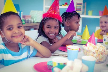 Wall Mural - Excited kids enjoying a birthday party