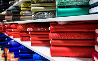 Wall Mural - Rolls of fabric and textiles in a factory shop or  store