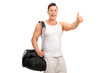 © Ljupco Smokovski - Muscular young man giving a thumb up