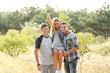 © Africa Studio - Guys holding a girl in the arms in the forest outdoors