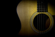 © Gpeg26 - Acoustic guitar isolated on black background, horizontal view, low key image