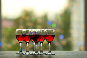 Poster - Wine glasses with wine on a table outside