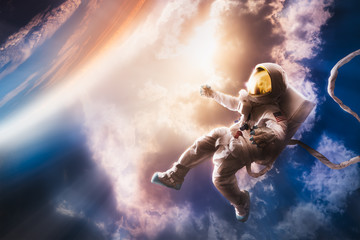 Wall Mural - astronaut floating in the atmosphere