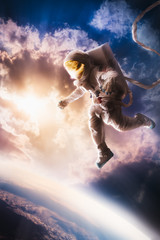 Wall Mural - astronaut floating in the atmosphere