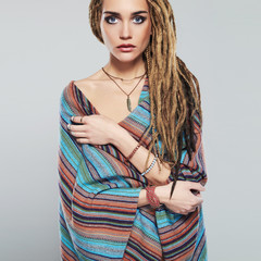 Wall Mural - beautiful girl with dreadlocks.young woman with braids hairstyle