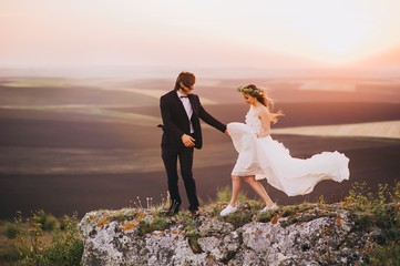 Wedding couple in the evening. Peaceful romantic moment.