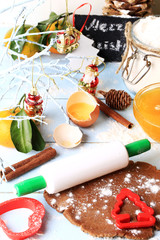 Wall Mural - rolled out dough for gingerbread Christmas homemade cakes on a light wooden background selective soft focus rustic style