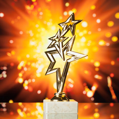 Wall Mural - gold stars trophy against shiny sparks background
