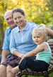 © DariaTrofimova - mature couple with child sitting on bench
