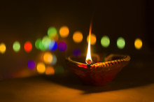 Earthen Lamp At Night With Bokeh Light In The Background