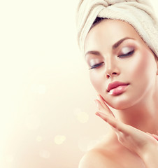 Wall Mural - spa woman. beautiful girl after bath touching her face