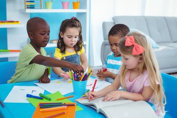 Wall Mural - Happy kids enjoying arts and crafts together