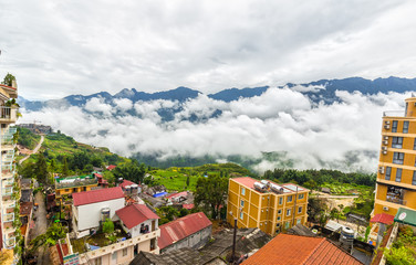 Wall Mural - The town of Sapa, Lao Cai, Vietnam in the early morning with cloud-capped mountain range. It attracts many tourists at home and abroad come here Resort
