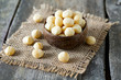 salted macadamia nuts on wooden surface