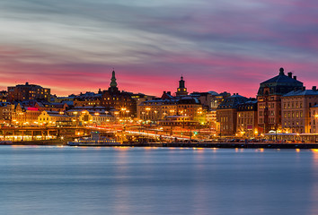 Canvas Print - Stockholm city on a winter night with beautiful pink sunset.