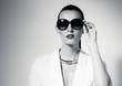 © kieferpix - Female fashion portrait wearing sunglasses.