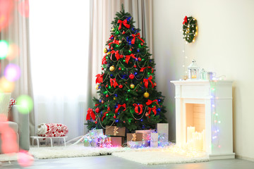 Wall Mural - Perfect Christmas tree with gifts underneath in living room