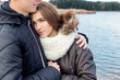 © nyushashypulia27 - beautiful young happy couple in love hugging on the shore of the lake on a warm Sunny evening